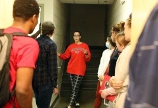 Students talking in hallway.