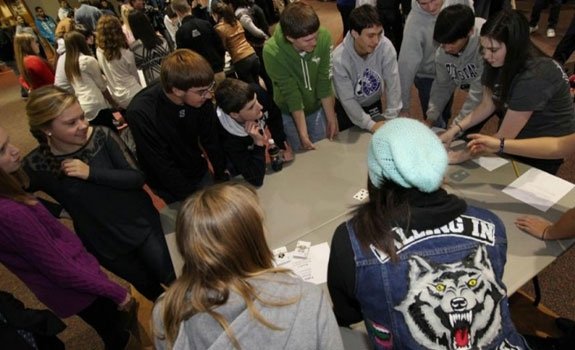 Students around a table during the math contest.