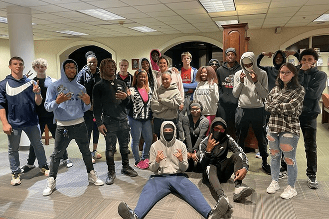 Members of the Black Student Union at Commonwealth University-Mansfield, formerly Mansfield University, gather for a group picture in the library.