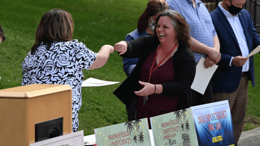 Two people given each other a fist bump. 