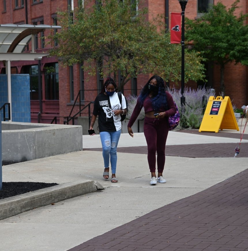 Students walking on campus. 