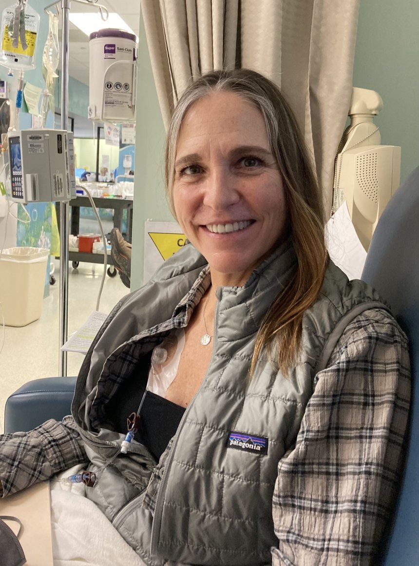 A woman sitting in a hospital. 