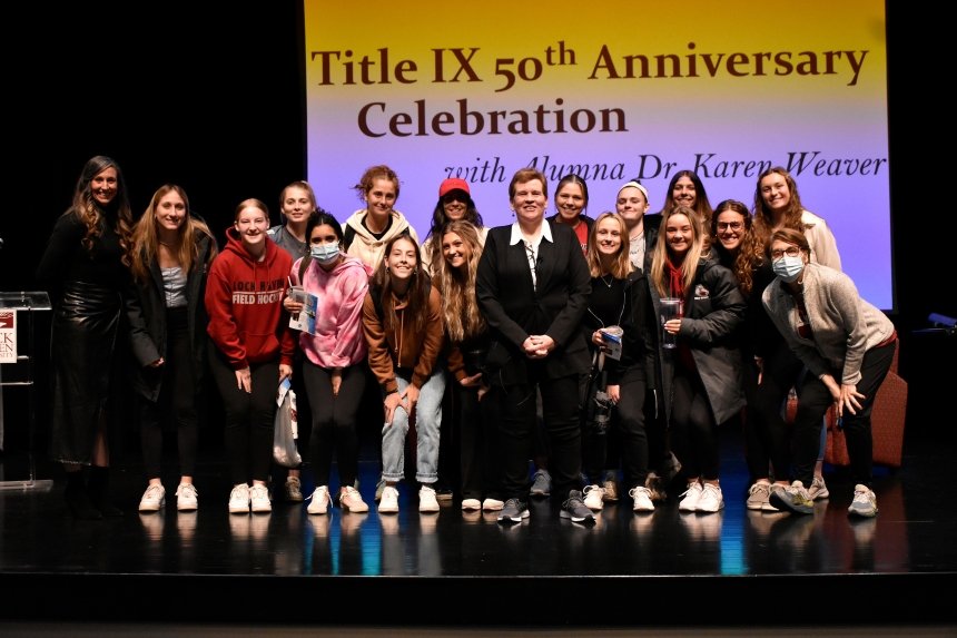 A group of people on stage. 