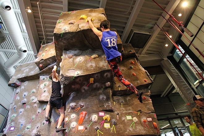 Quest students rock climbing indoors.